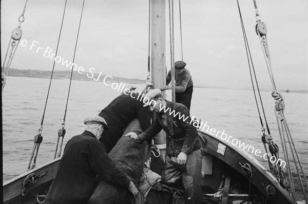 BOATS AND BOATMEN WITH LIFEBOAT TO INNISHMAAN CASHLA BAY  FR KILLEAN PP AND FR KEANE S.J.